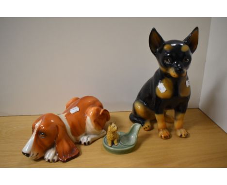 A Goebel style pottery Doberman statue, 35cm tall, together with a hound of similar design, and a Wade Cairn Terrier pipe sta