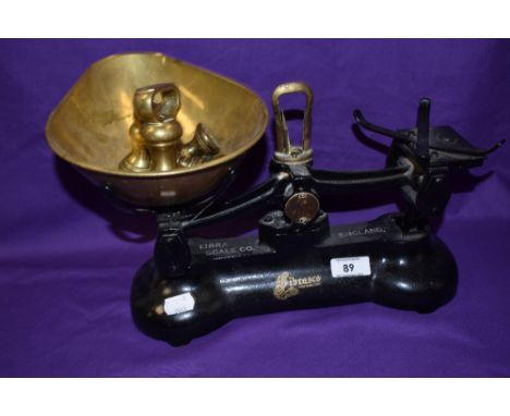 A set of vintage black painted Librasco kitchen scales with weights