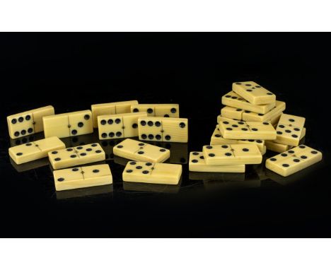 A Set Of Early 20th Century Bakelite/Cellulose Dominoes Of traditional rectangular form in cream, uniform wood grain effect b