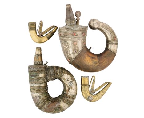 the first with large horn body, fitted with a silver mounts top and bottom, each decorated with filigree and set with coral, 