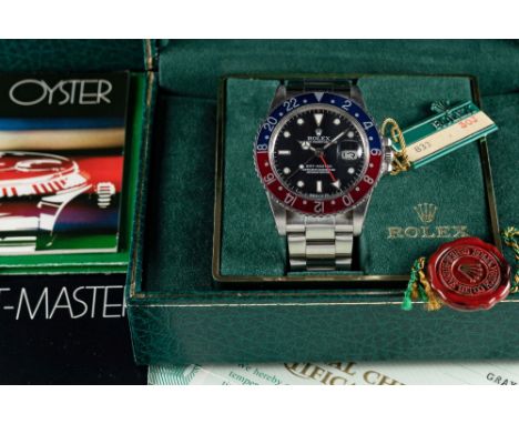 A RARE GENTLEMAN'S STAINLESS STEEL ROLEX OYSTER PERPETUAL DATE GMT MASTER "PEPSI" BRACELET WATCHCIRCA 1984, REF. 16750 "TRANS