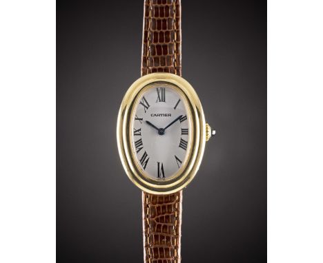 A LADIES 18K SOLID GOLD CARTIER BAIGNOIRE WRIST WATCHCIRCA 1980sMovement: Manual wind, signed Cartier.Case: Approx. 32mm by 2