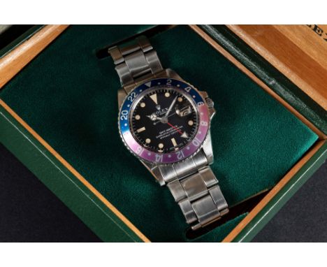 A RARE GENTLEMAN'S STAINLESS STEEL ROLEX OYSTER PERPETUAL "PINK PANTHER" GMT MASTER BRACELET WATCHCIRCA 1969, REF. 1675 WITH 