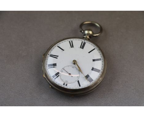 Silver open face key wind pocket watch, white enamel dial and subsidiary seconds dial, black Roman numerals and minute track,