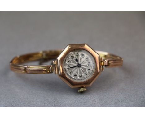 A circa 1920s 9ct rose gold cased wristwatch on original rose gold bracelet strap, hexagonal case with circular silvered dial