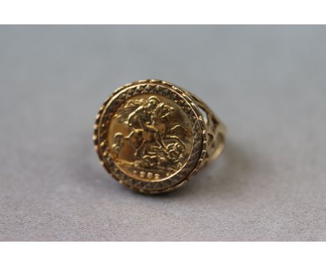 A half sovereign 9ct yellow gold ring, George and the Dragon 1982 mounted half sovereign, ring size approximately R (shank mi