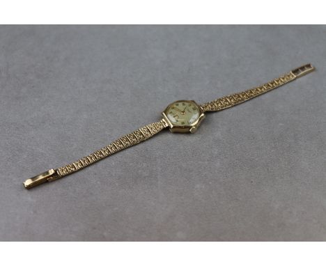 Ladies 9ct Tissot cocktail watch with 9ct strap, the 15 jewel movement is numbered 1902474 and the case marked "Dennison"