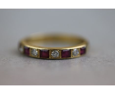 A ruby and diamond 18ct yellow gold half eternity ring, alternate small round brilliant cut diamonds and square mixed cut rub