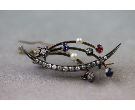 A Victorian diamond, sapphire, ruby and seed pearl crescent and shooting star rose gold and silver set brooch, the crescent f