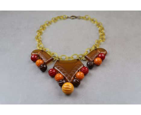 Art Deco Bakelite fringe necklace, three carved Bakelite panels with carved red, orange and brown Bakelite spheres suspended 