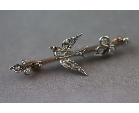 A late Victorian/ Edwardian swallow diamond brooch, the central swallow in flight motif full set with fifteen small rose cut 