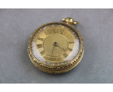 An Edwardian 18ct gold cased open face pocket watch, gold engine turned dial with gold Arabic numerals and poker hands, yello