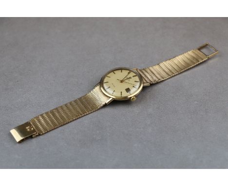Gents 9ct Gold Omega Automatic Seamaster De Ville wristwatch with Original 9ct Gold mesh strap, the metallic dial has a sweep