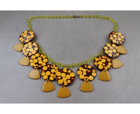 Vintage bakelite disk necklace, probably Charles Elkaim circa 1950s/1960s, bearing nine polka dot injection brown and yellow 