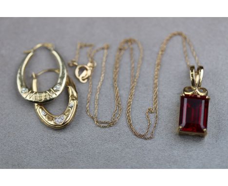 A synthetic ruby 10ct yellow gold pendant necklace, rectangular step cut synthetic ruby, four claw setting, on fine 10ct yell