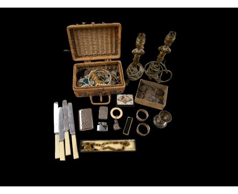 Two brass cherub lamps, two silver napkins and a silver cat teething ring, collection of lighters including Dunhill Calibri M