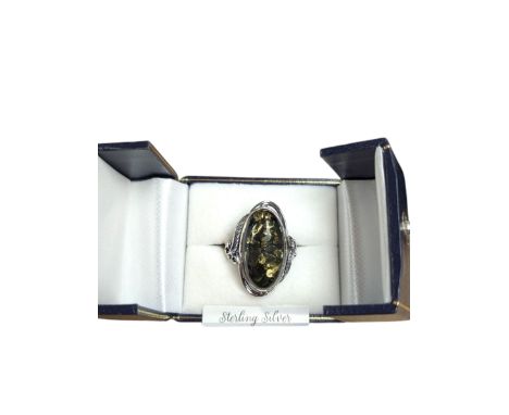 Silver green Baltic amber ring, stamped 925, boxedCondition Report:Size R