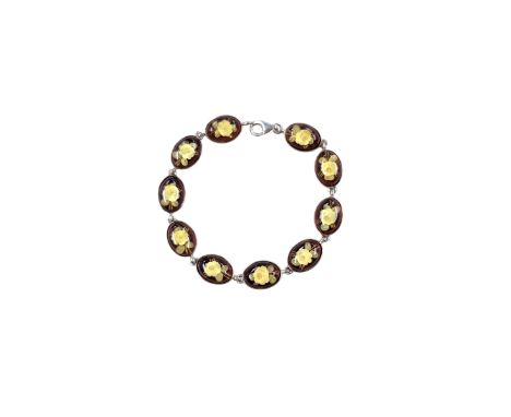 Silver Baltic amber oval link bracelet, with engraved rose decoration, stamped 925Condition Report:Length = 20cm