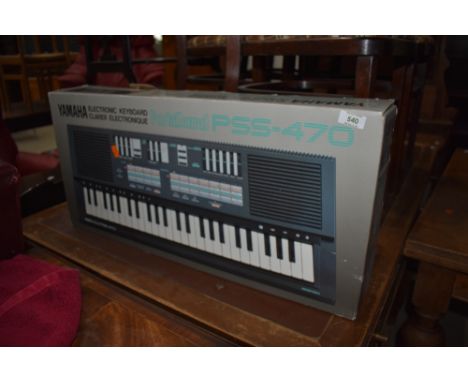 A Yamaha Portasound PSS-470 short scale keyboard, boxed