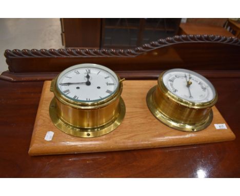 A brass marine style clock mounted on golden oak and a similar barometer, board size approx. 54 x 26cm