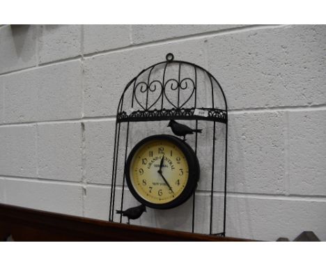 A modern garden style wall clock, aviary interest