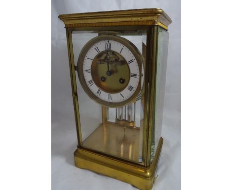 Four glass mantle clock : a 19 th c French gilded brass cased , four bevelled glass sided 8 day clock with open movement visi
