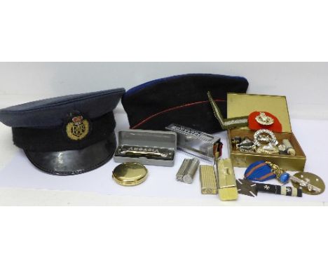 A cap with RAF badge, other badges, a lighter and a harmonica, etc.