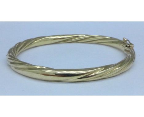 A 9ct gold bangle, 16.1g