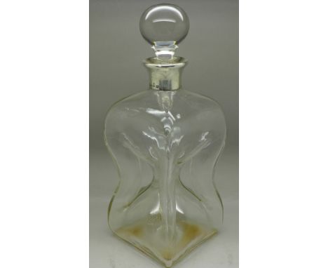 A pinch bottle decanter with silver top, the top marked Asprey, London, date letter rubbed