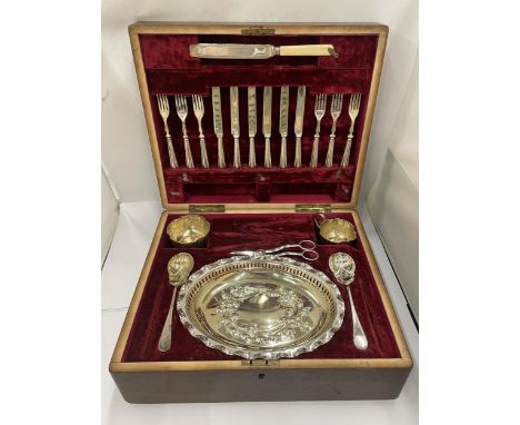 A VINTAGE OAK CASED CANTEEN SERVING SET WITH SILVER PLATED DISH, SERVERS AND CUPS AND CUTLERY WITH HALLMARKED SILVER COLLARS 