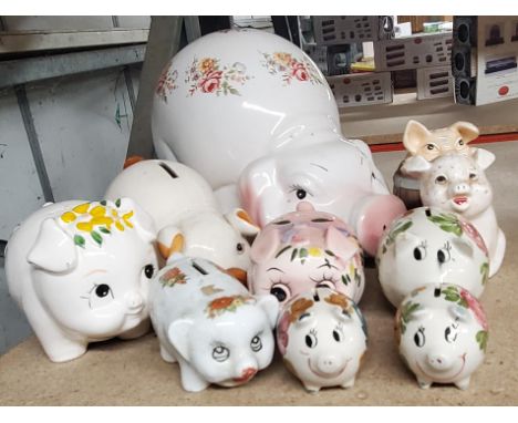 A COLLECTION OF CERAMIC PIG MONEY BOXES 