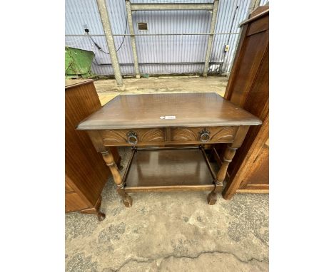 A VINTAGE OAK TABLE WITH LOWER SHELF 