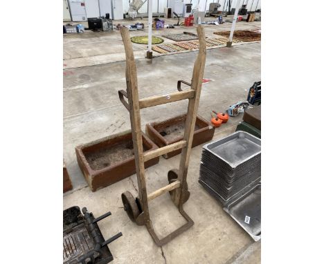 A VINTAGE WOODEN AND CAST METAL SACK TRUCK 