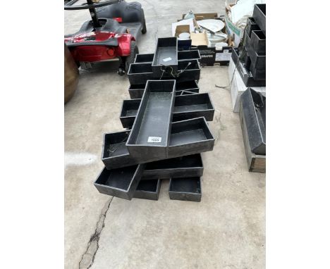 AN ASSORTMENT OF SMALL TROUGH PLANTERS 