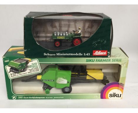 TWO BOXED FARM MODELS, A SCHUCO FENDT TRACTOR, 1/43 SCALE AND A SIKU DEUTZ BALER, 1/32 SCALE 