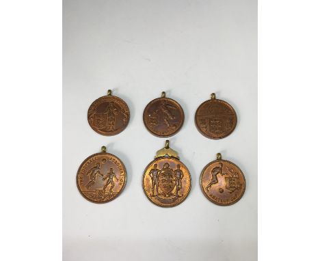SIX FOOTBALL ASSOCIATION MEDALS ALL  UNFINISHED AND THOUGHT TO DATE BACK TO 1940'S (MADE BY THE FATHER OF THE VENDOR WHO WORK
