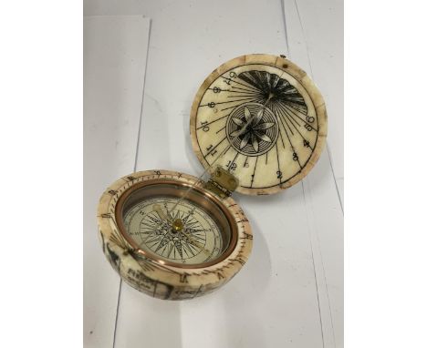 A VINTAGE BONE GLOBE COMPASS 