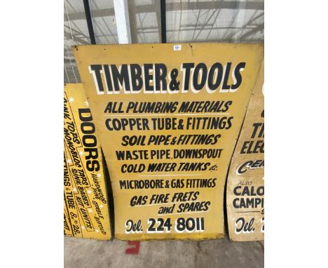 A WOODEN 'TIMBER &amp; TOOLS' SIGN 