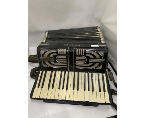 A VINTAGE HOHNER TANGO II ACCORDIAN 