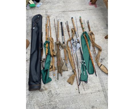 AN ASSORTMENT OF VARIOUS VINTAGE FISHING RODS 