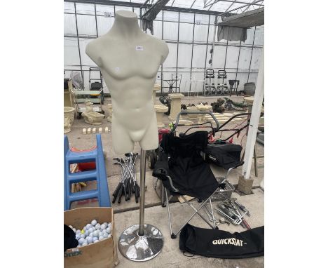 A MALE TORSO MANNEQUIN ON A CHROME STAND 