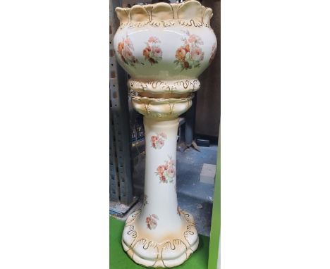 A VINTAGE FLORAL JARDINIERE AND STAND 