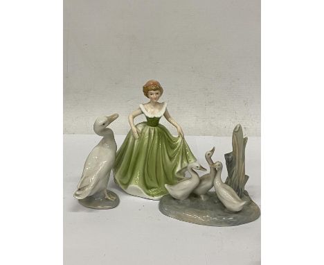 A SHUDEHILL FIGURE OF A LADY IN A GREEN DRESS TOGETHER WITH A LLADRO FIGURE OF A DUCK AND A NAO FIGURE OF THREE DUCKS 