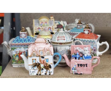A COLLECTION OF NOVELTY CERAMIC TEAPOTS ETC 
