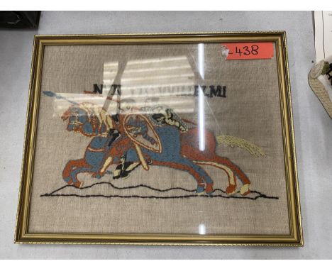 A FRAMED WOOLWORK TAPESTRY OF JOUSTING HORSES 