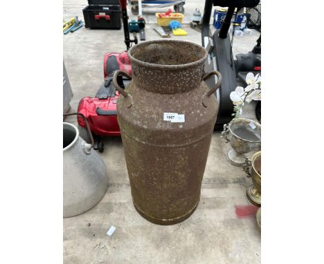 A VINTAGE CAST IRON MILK CHURN 