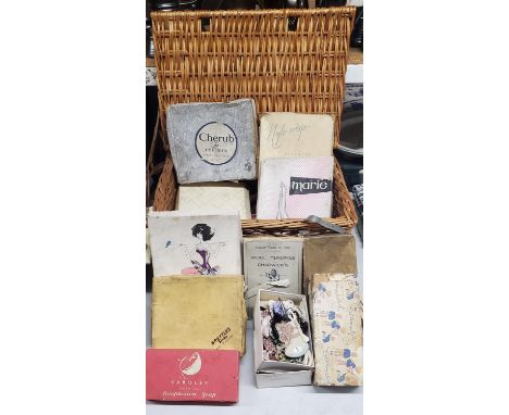 A WICKER BASKET CONTAINING A QUANTITY OF VINTAGE ADVERTISING PACKAGING 