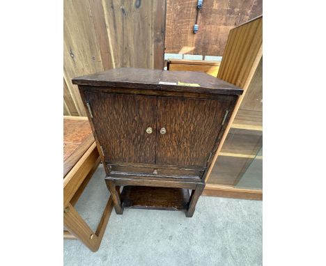 A VINTAGE OAK SEWING CABINET 