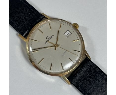 A VINTAGE BOXED 9CT YELLOW GOLD CASED GENTS GARRARD QUARTZ DATE WATCH, 9CT GOLD CASE BACK WEIGHS 5G ALONE 