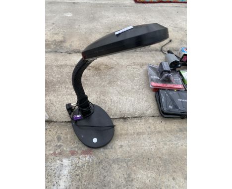 AN ADJUSTABLE READING LAMP 